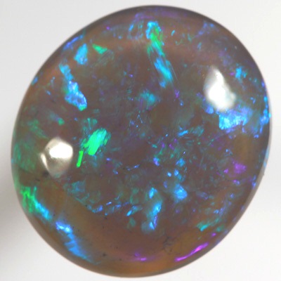 SOLID BLACK CRYSTAL OPAL Rolling flashes of green and turquoise fire in a 3D pattern